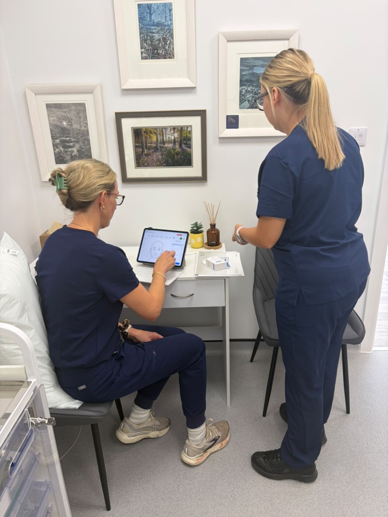 Delegate planning treatment on a tablet with the trainer alongside