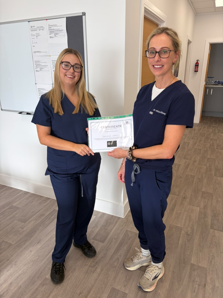 Delegate receiving her training certificate from the trainer