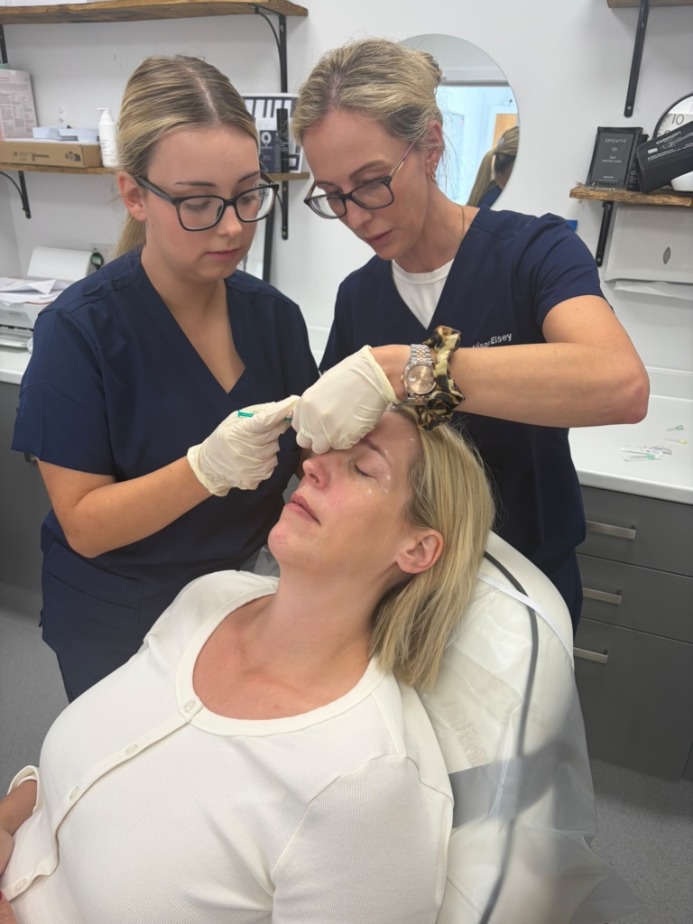 Trainer giving close one-to-one guidance during treatment